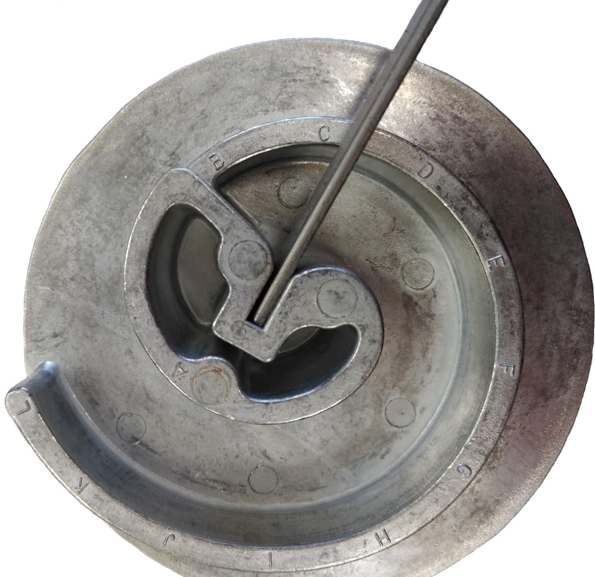 Piece of flat metal strip inserted all the way into starting slot on the BJ5 Scroll Bender. One can also insert partway into slot to prevent flat spot.