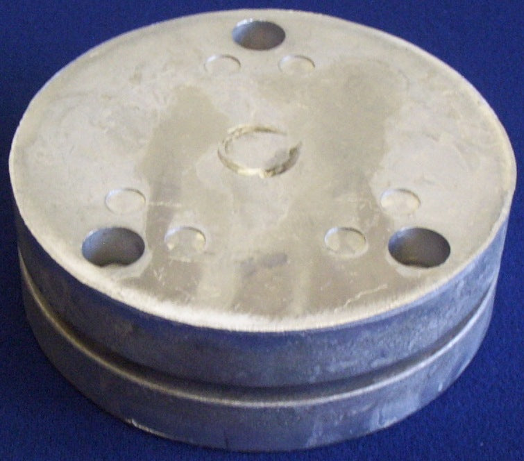 Step 4 in fluting a tray. Blank flat plain disc (our DP2 or DP2withHole) sits between female and male parts making up the Kosy Creations Fluting Die Set FD1