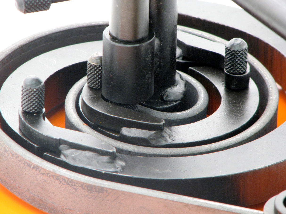 Extreme closeup of scroll segments with metal wrapping around segments.