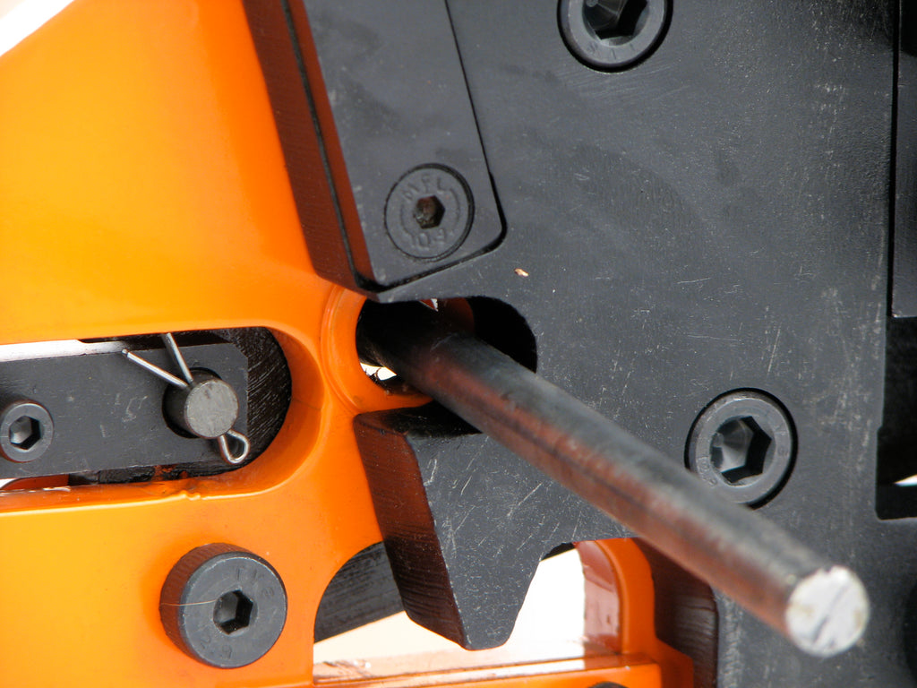 Closeup of separate area on the Metalcraft XL5+ Power Bender utilized to shear solid round rod and solid square bar