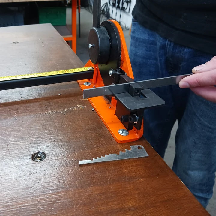 Once set the flat metal steel strip is inserted in Metalcraft Punch/Shear tool and hole punched