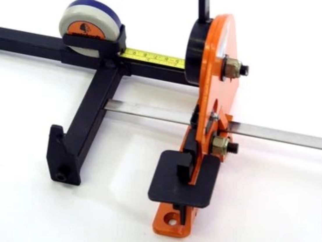 Shearing of metal shown on the Metalcraft Practical Punch Shear Tool. Measuring Device can be set so metal is sheared in equal lengths