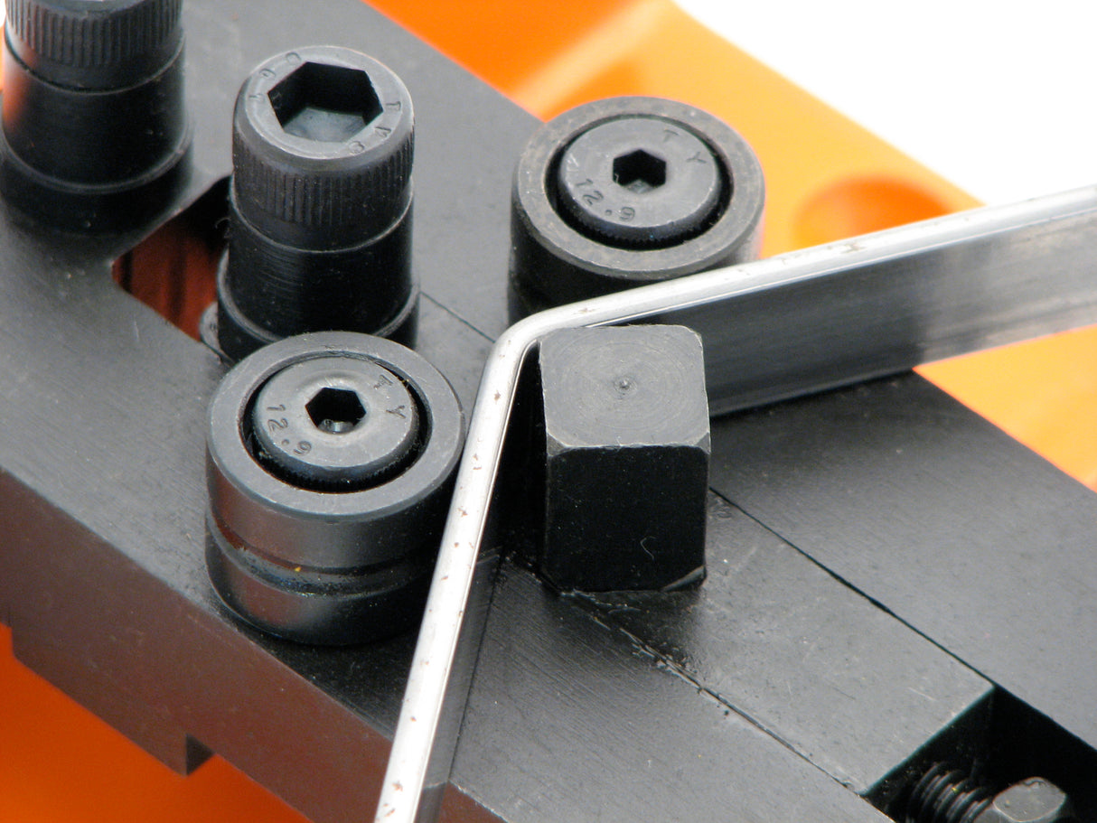 Piece of flat metal steel strip being angle bent on the Metalcraft Practical Riveting Bending Rolling Tool