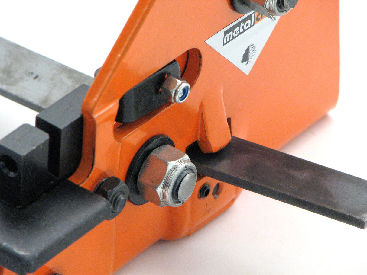 Steel placed in the Metalcraft Practical Punch Shear Tool ready to be sheared.  There is a hold down so the metal doesn't ride up when shearing.