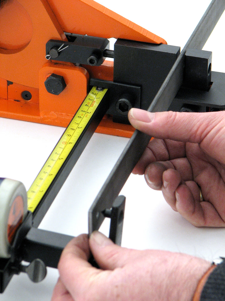 Metalcraft Master Punch/Shear using Measuring Device to accurately punch holes a certain distance apart from each other.