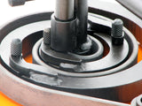 Extreme closeup of scroll segments with metal wrapping around segments.