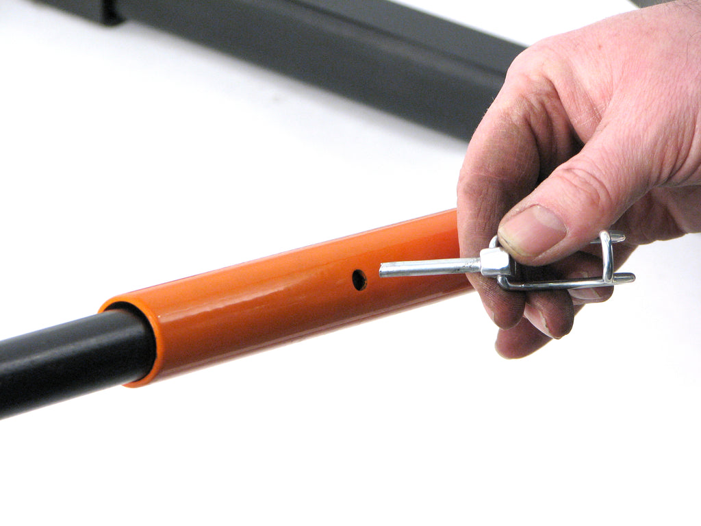Closeup of pin being inserted into extension handles on the Metalcraft XL Pro Twister