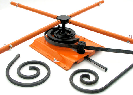 Metalcraft Scroll Bender MK3/4 Former showing scrolls made out of flat metal steel strip, solid square bar, and solid round rod.