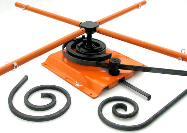 Metalcraft Scroll Bender MK3/4 Former showing scrolls made out of flat metal steel strip, solid square bar, and solid round rod.