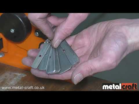 Sample pieces kept as templates to find center of metal for punching holes quickly in various widths of metal strip